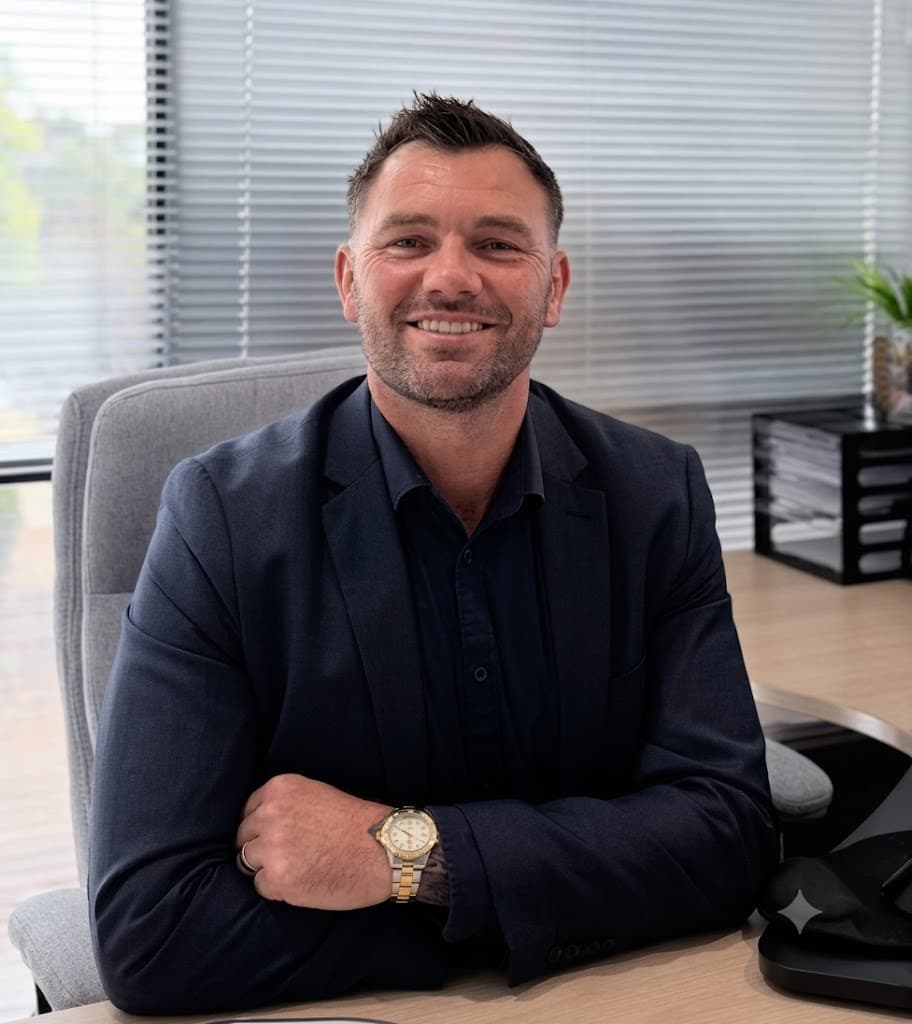 Josh seated at his desk in the Kismet office